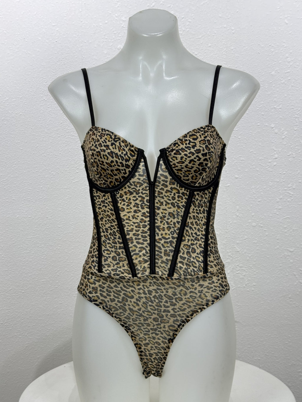 Front view of the Tansy leopard bodysuit on a mannequin.