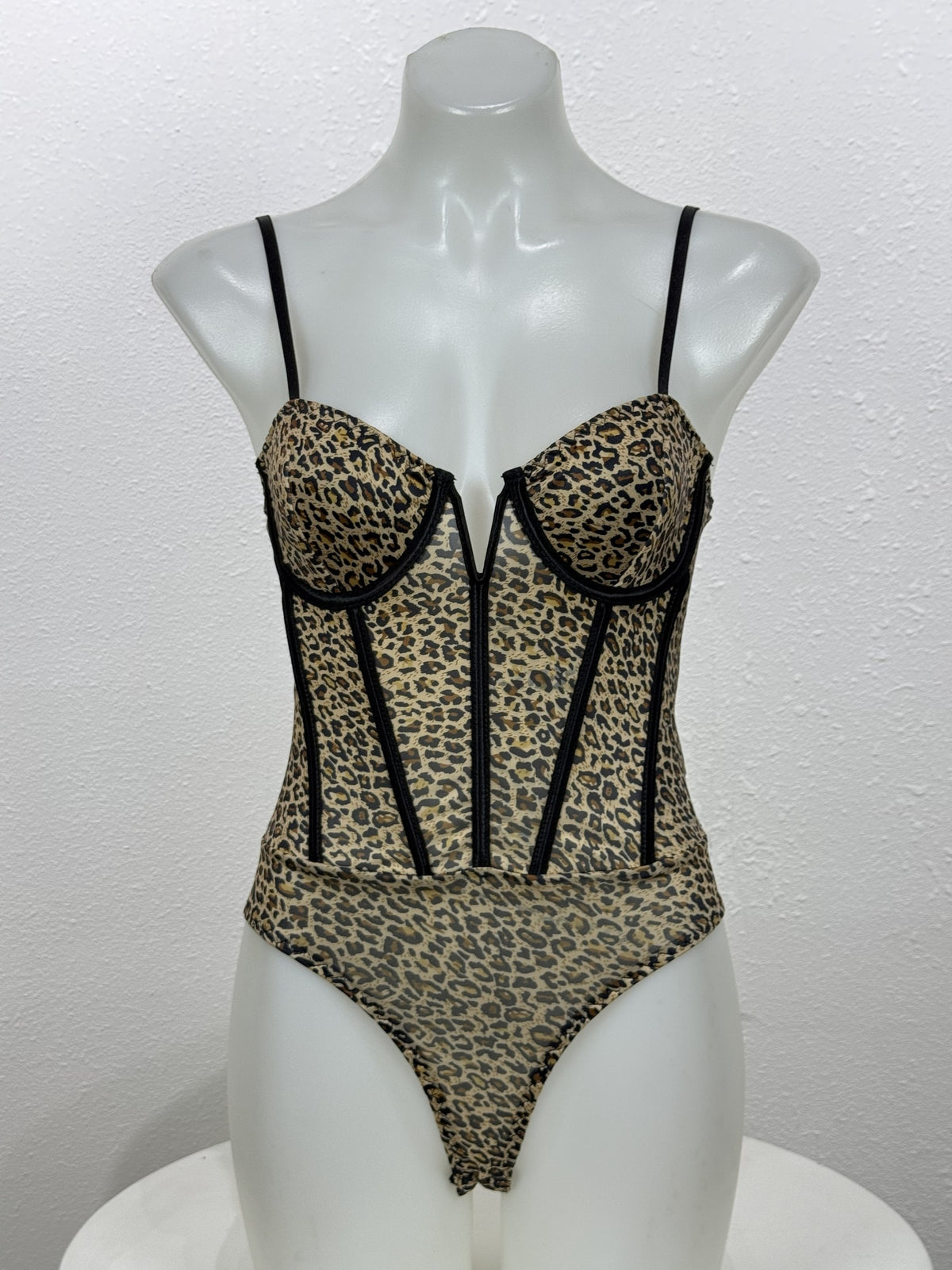 Front view of the Tansy leopard bodysuit on a mannequin.