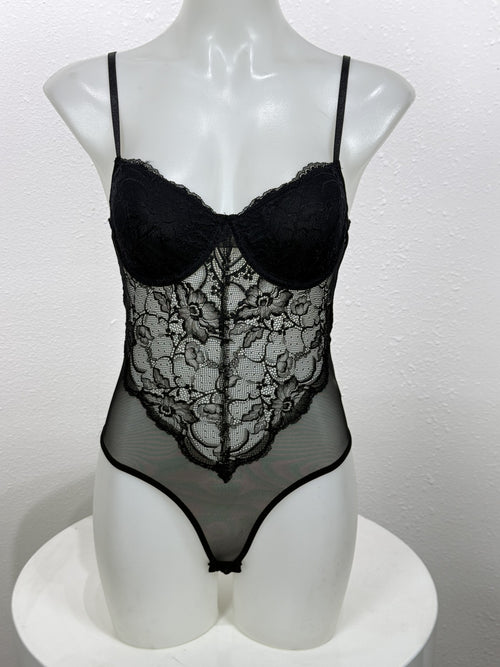 Front view of the Nightshade black lace bodysuit on a mannequin.