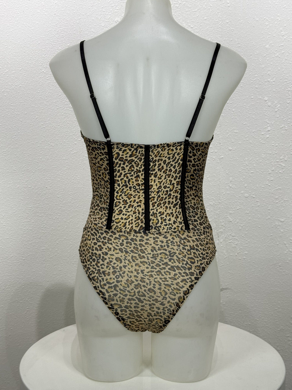 Back view of the Tansy leopard bodysuit on a mannequin.
